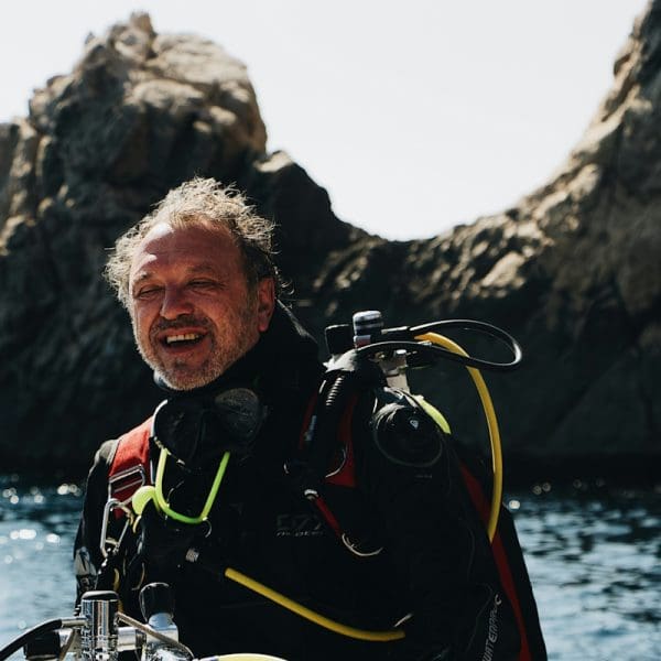 Diver checking equipment on a scuba diving liveaboard trip.