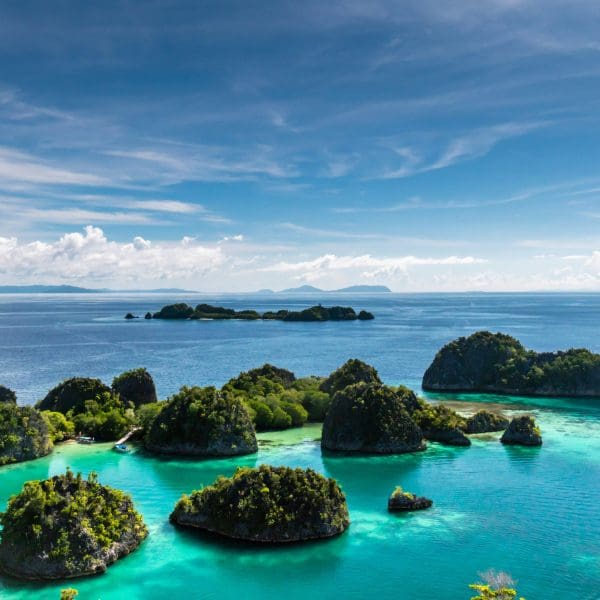 Tropical lagoon with clear turquoise waters and lush islands.