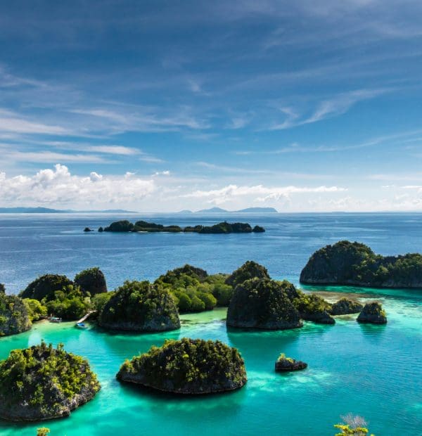 Tropical lagoon with clear turquoise waters and lush islands.
