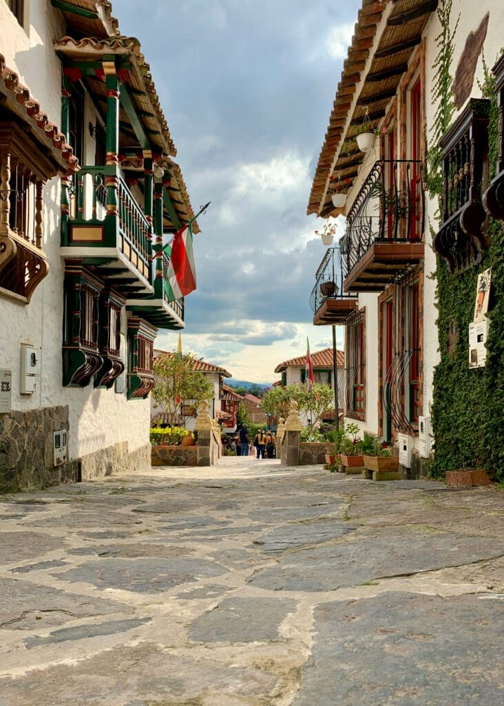 Traditional street with colonial architecture and cobblestones.