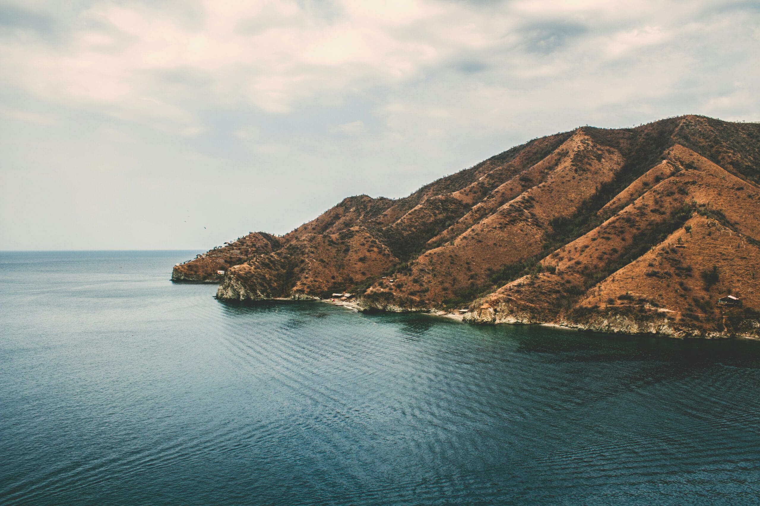 Rugged coastal hills overlooking serene ocean