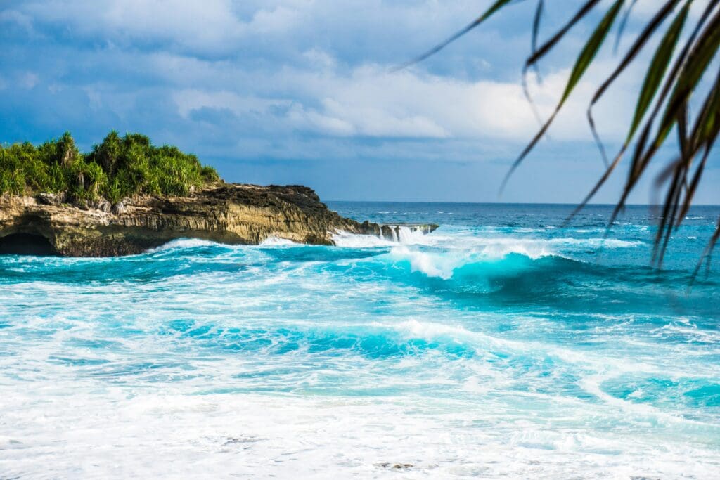 Vibrant tropical beach with crashing blue waves