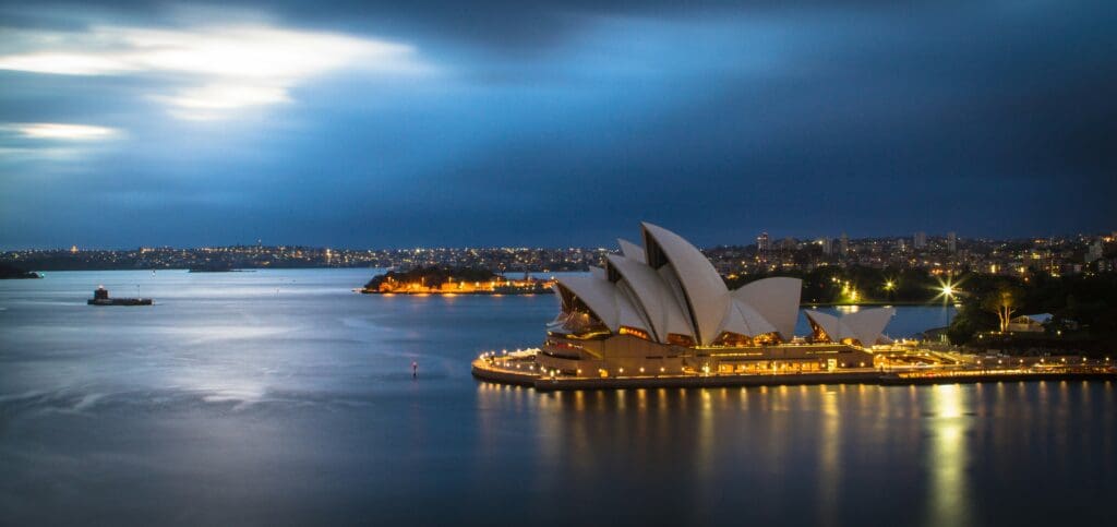 Sydney Opera House at night with illuminated skyline