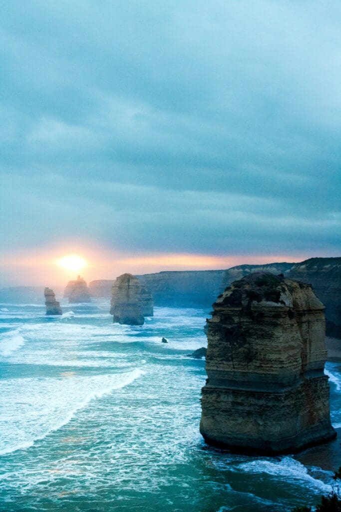 Sunset over ocean cliffs and turbulent waves