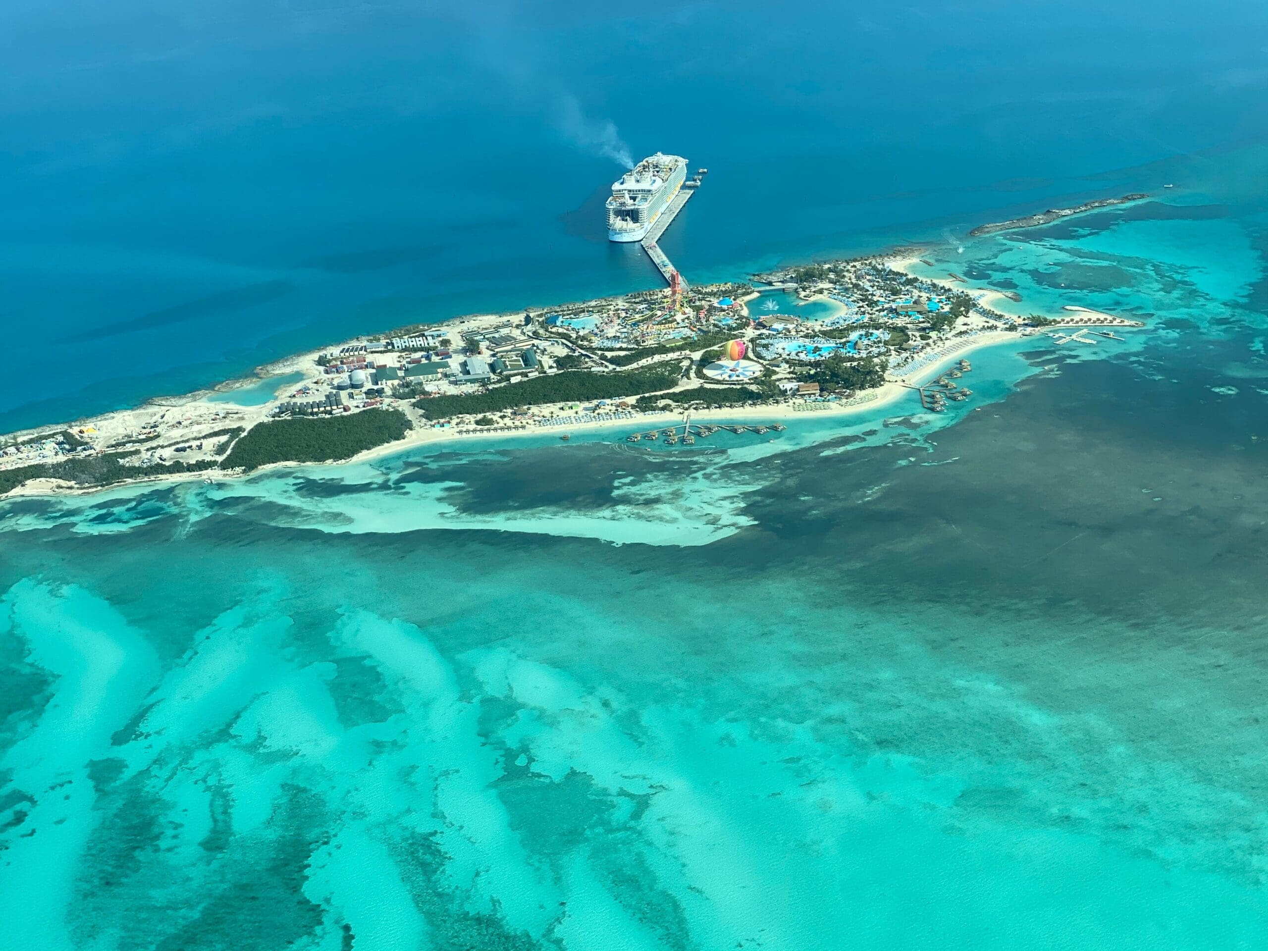 Aerial view of cruise ship near tropical island resort
