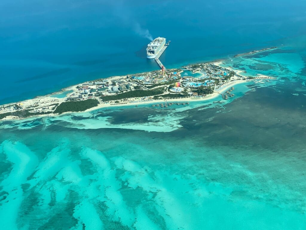 Aerial view of cruise ship near tropical island resort