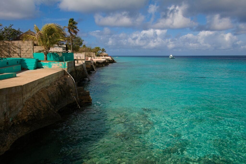 Tropical seascape with clear turquoise water and boat