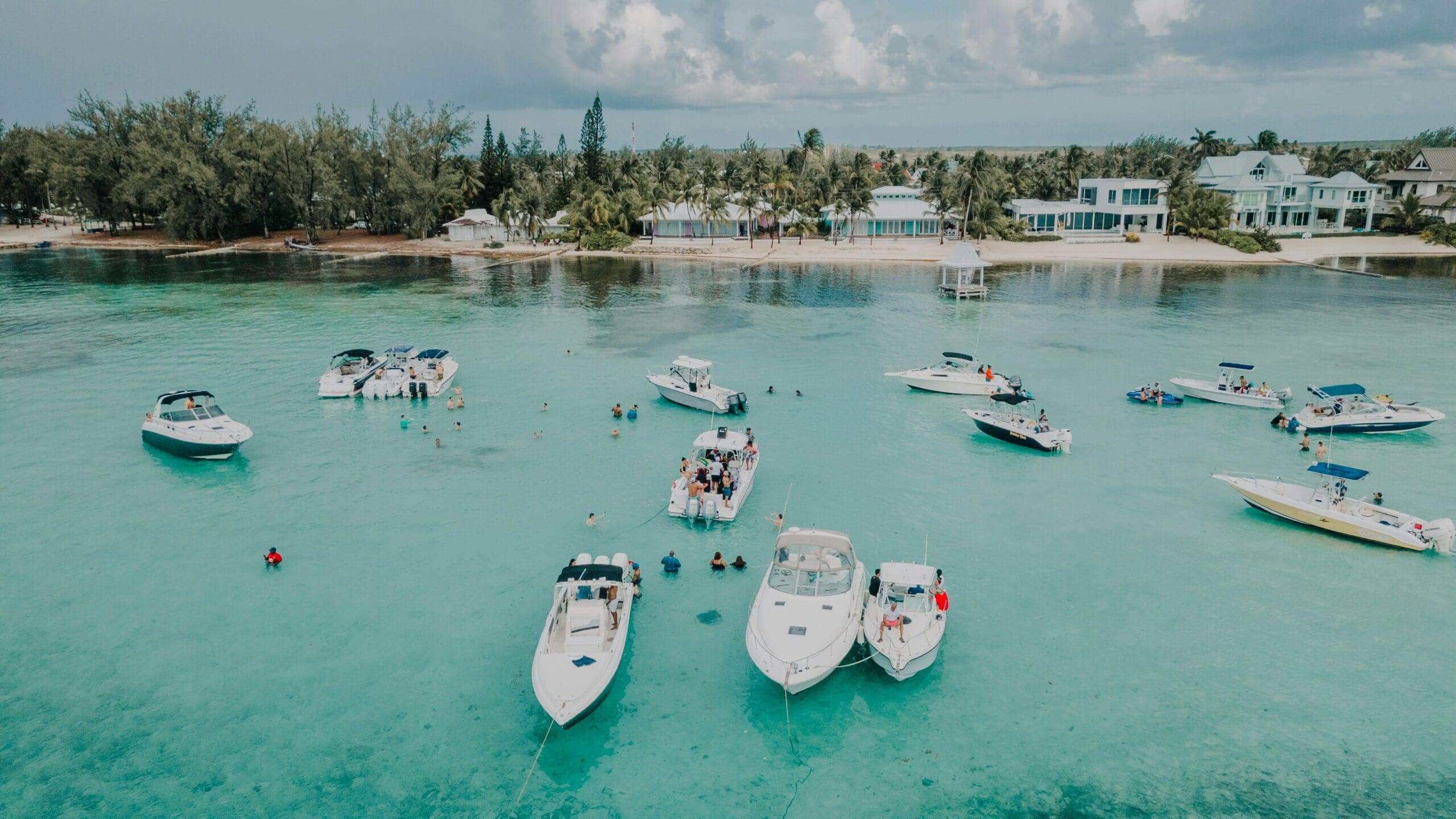 Boats and people enjoying clear tropical waters