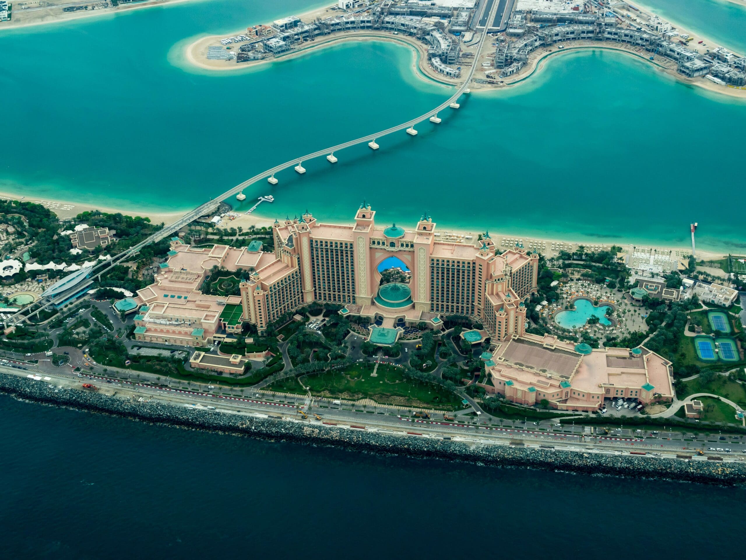 Aerial view of luxury coastal resort with turquoise waters