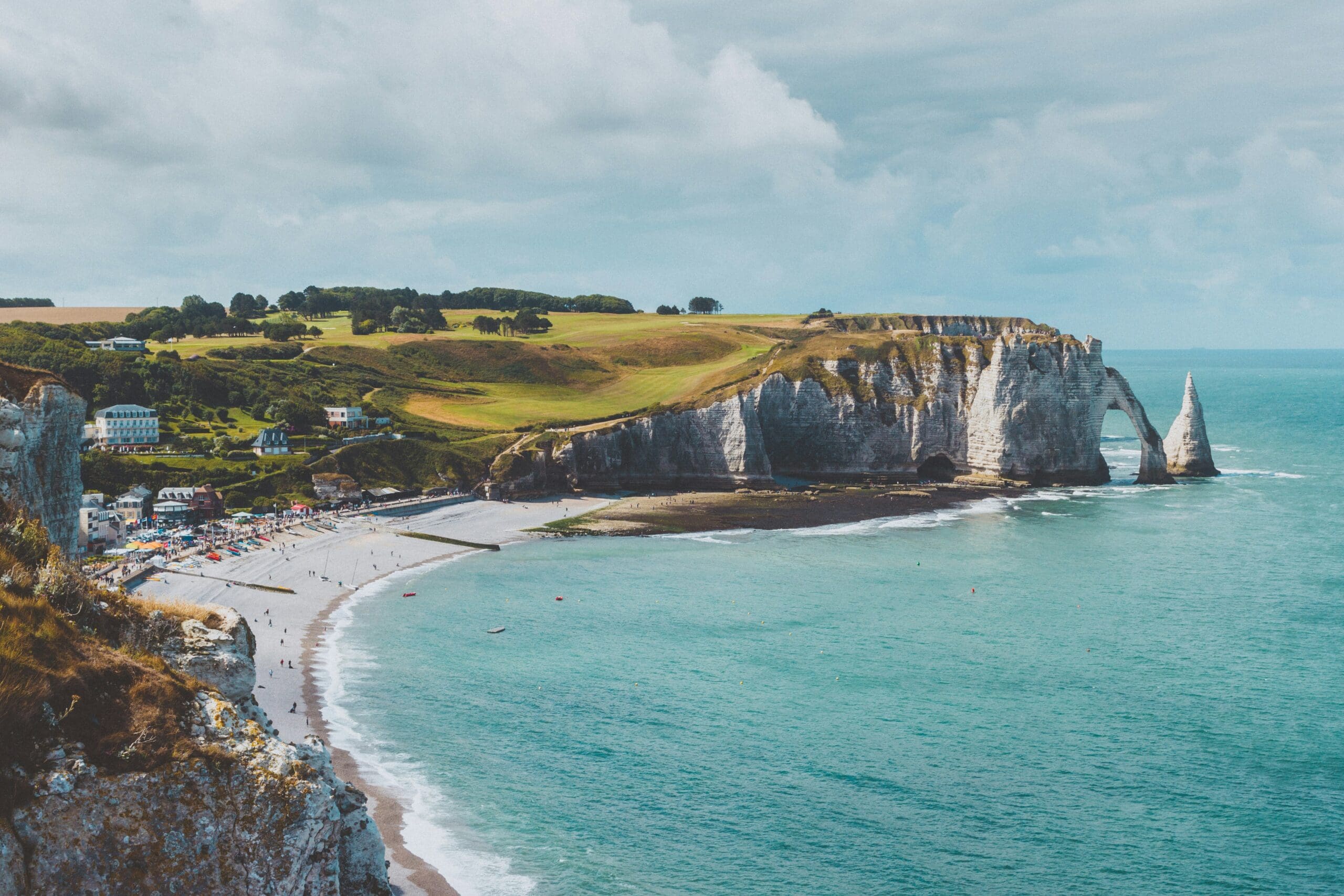 Scenic coastal cliffs with beach and sharp rock formations