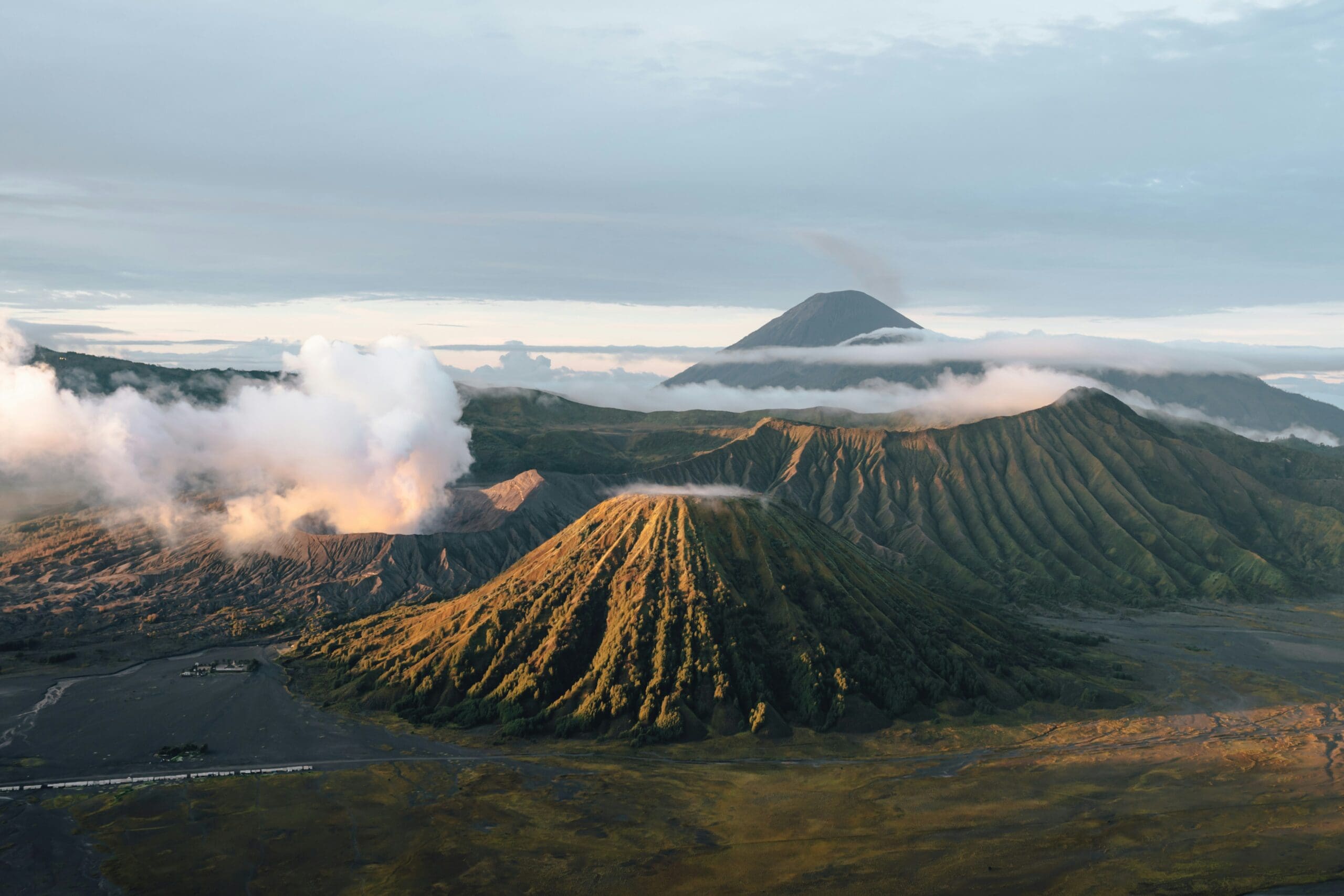 Sunrise over misty volcanic mountain landscape