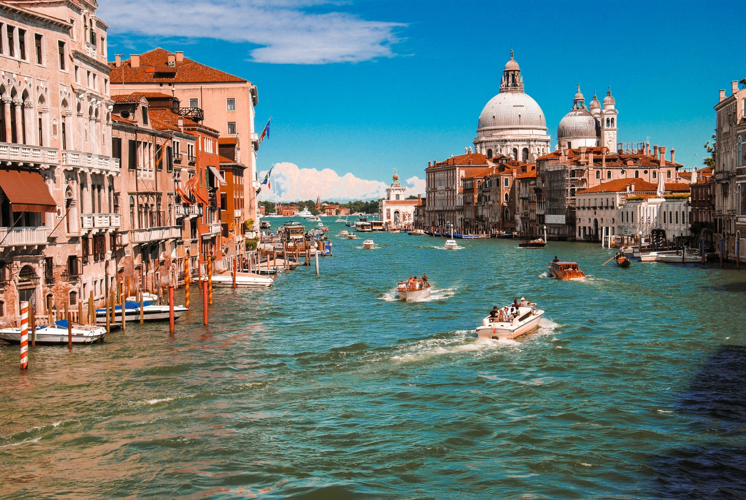 Vibrant Grand Canal, Venice with boats and historic buildings