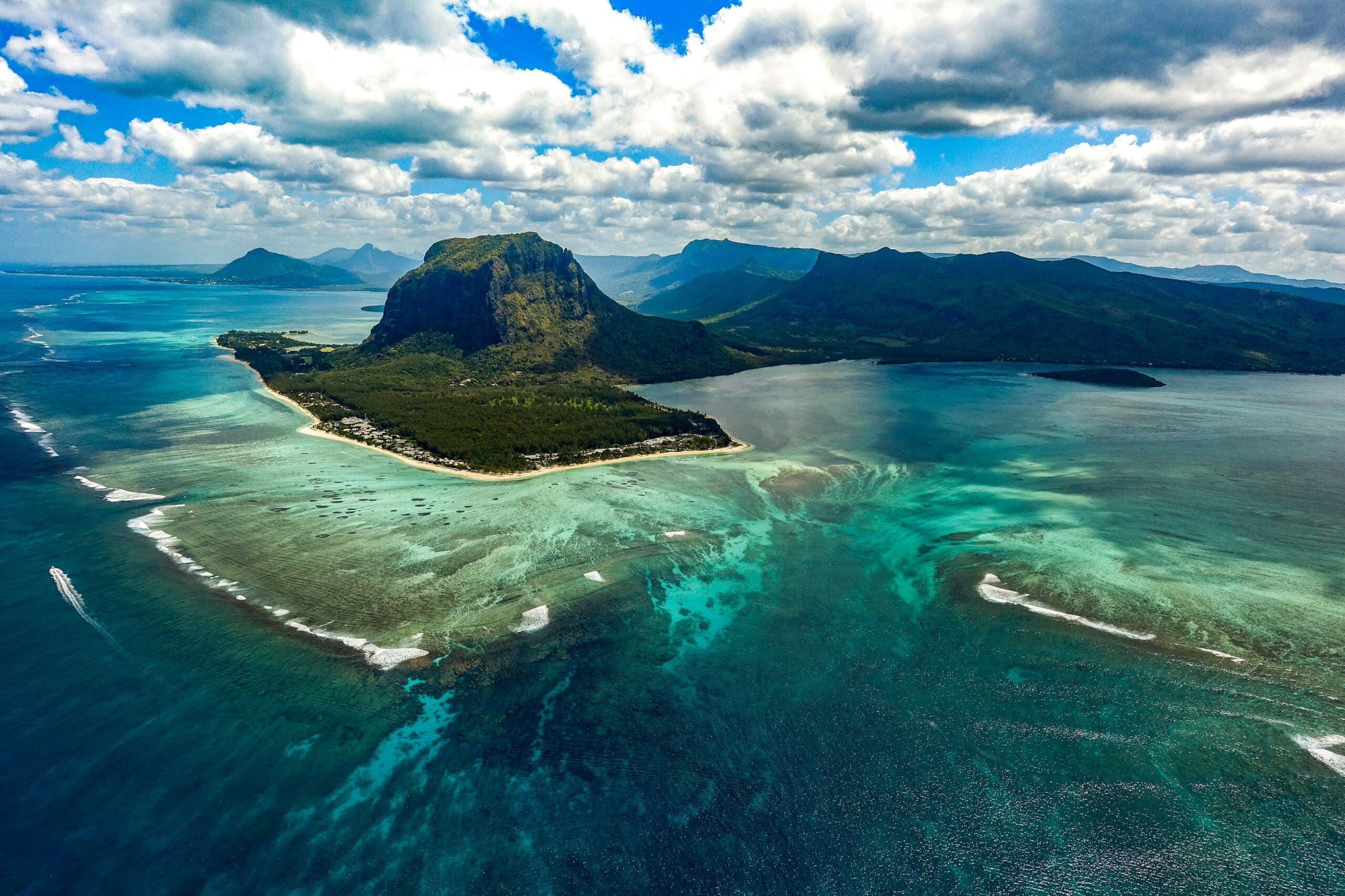 Aerial view of lush mountainous island and turquoise sea