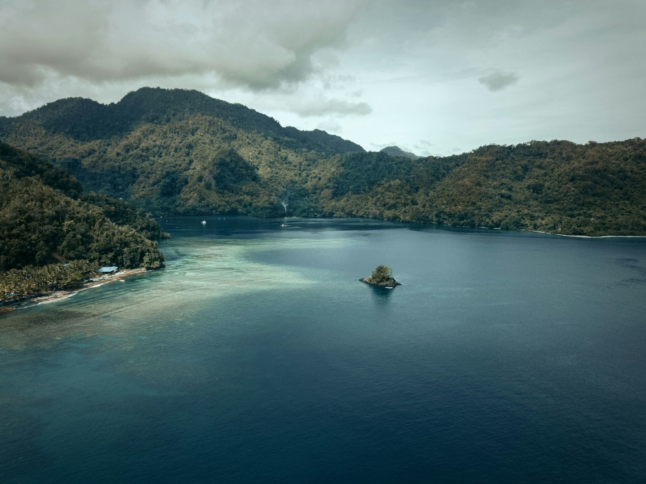 Aerial view of lush tropical island and blue sea
