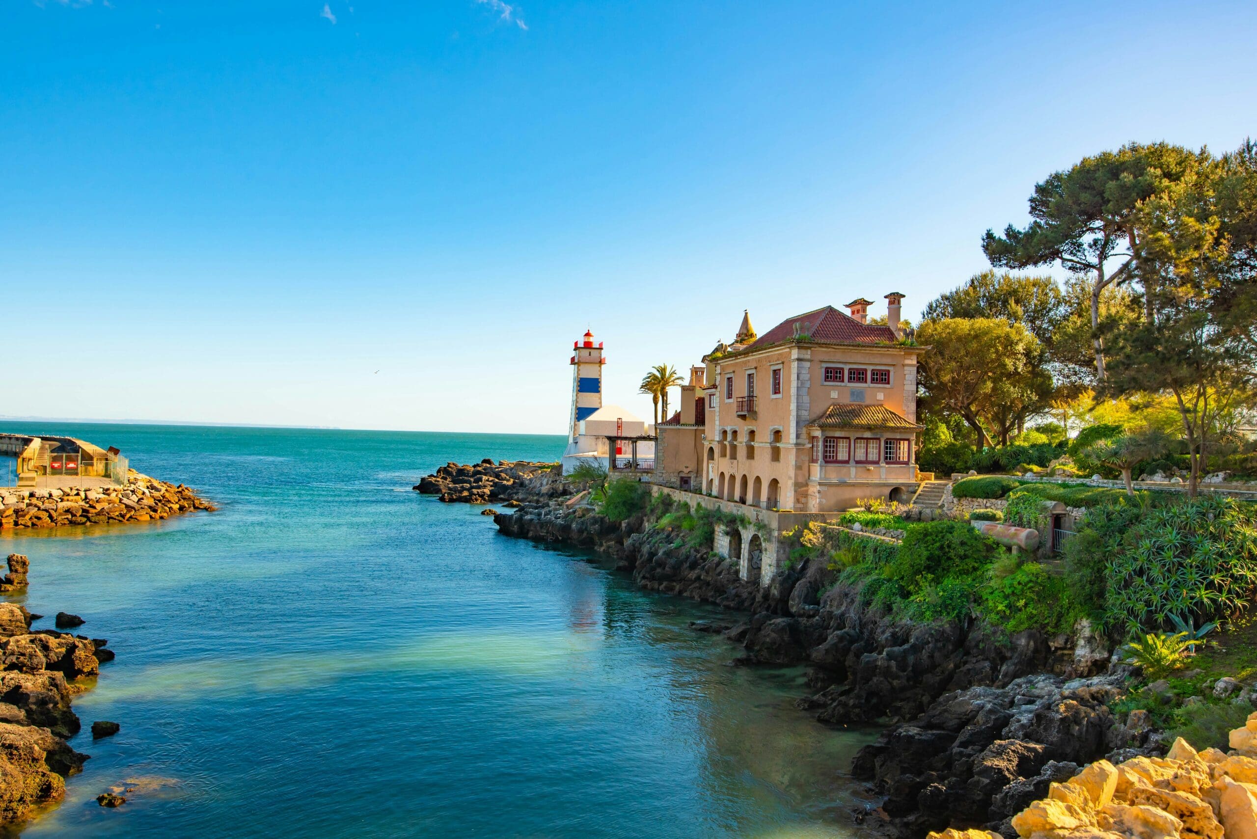 Coastal view with lighthouse and traditional house