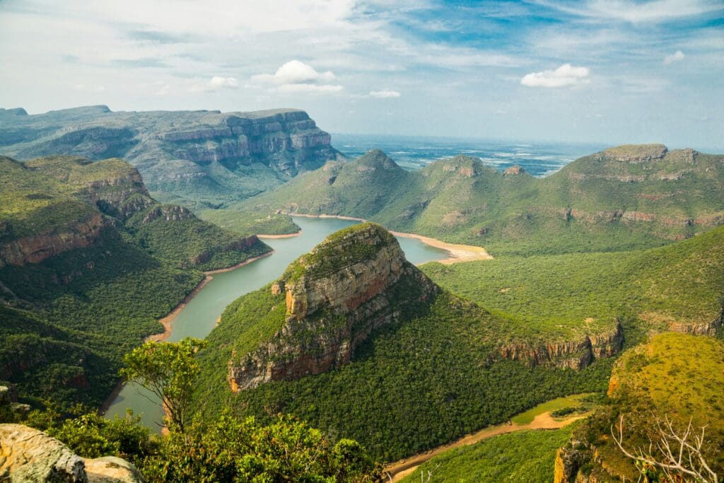 Scenic river winding through lush green mountains