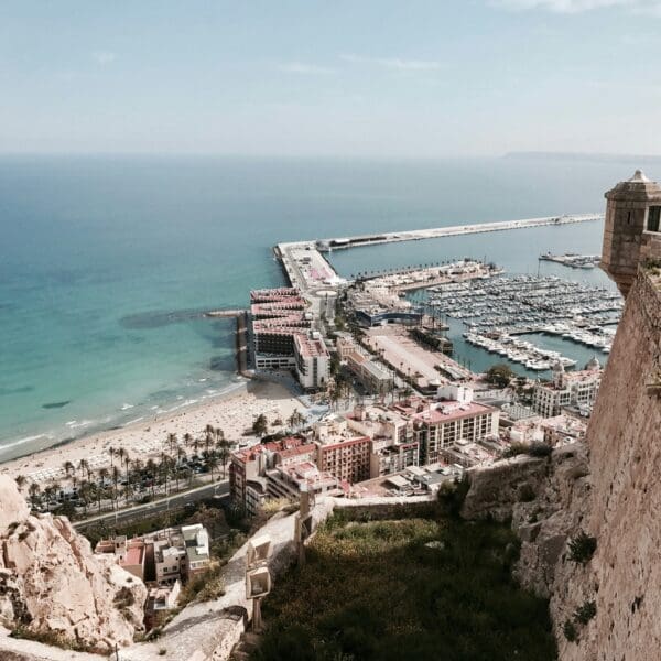 Aerial view of coastal city with marina and beach