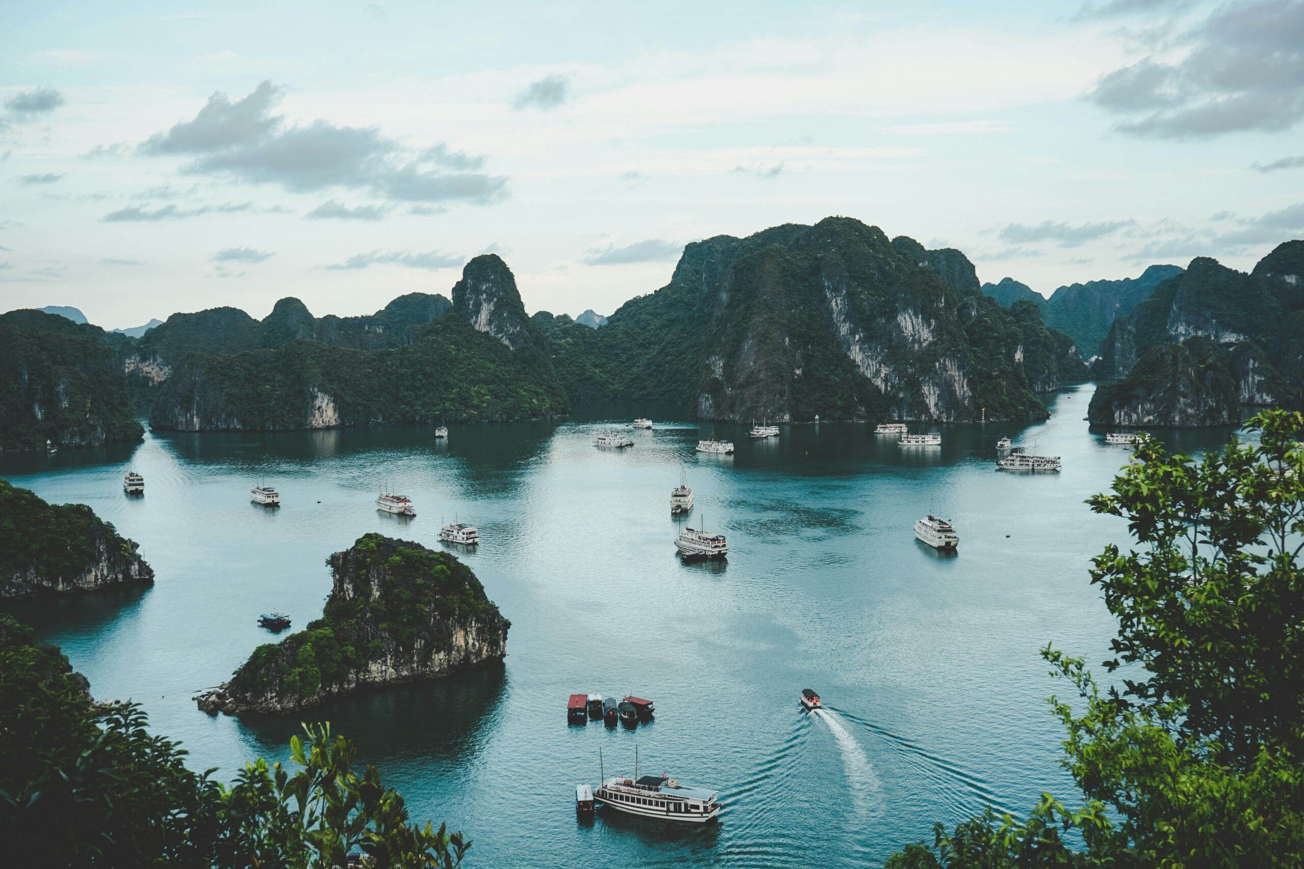 Scenic view of Halong Bay with boats and limestone cliffs