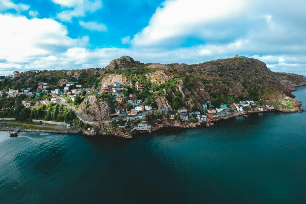 Aerial view of colorful coastal village on rocky cliffs