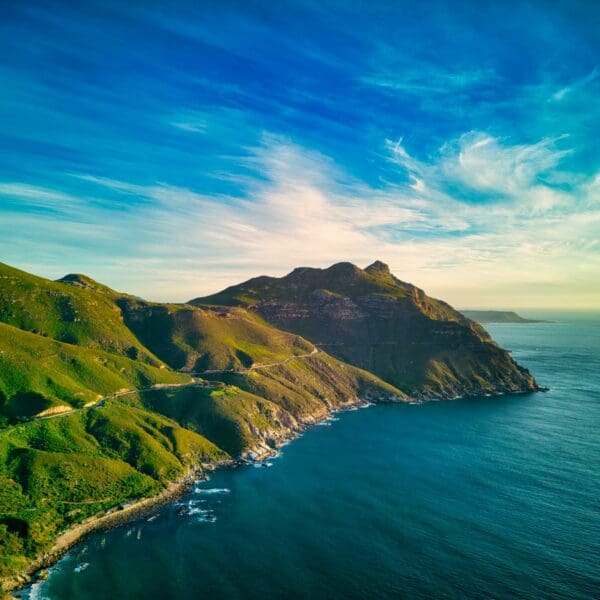 a scenic view of the ocean and mountains